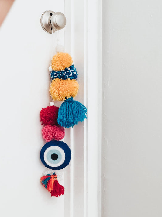 Handmade Evil Eye Pom Pom Door Hanger: Scented Boho Yarn Decor